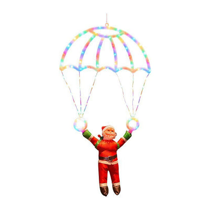 Père Noël en parachute lumineux