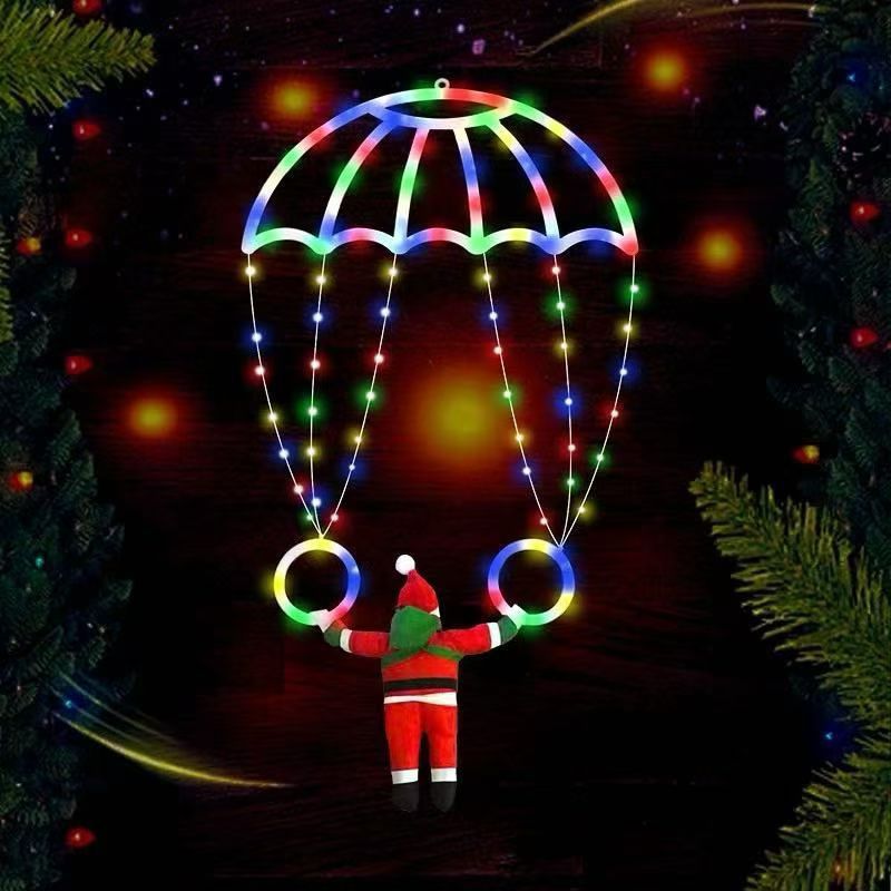 Père Noël en parachute lumineux