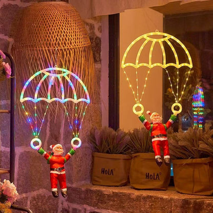 Père Noël en parachute lumineux