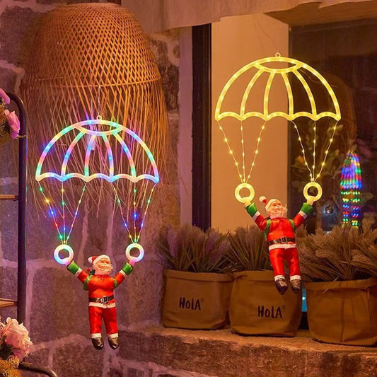 Père Noël en parachute lumineux