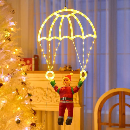 Père Noël en parachute lumineux